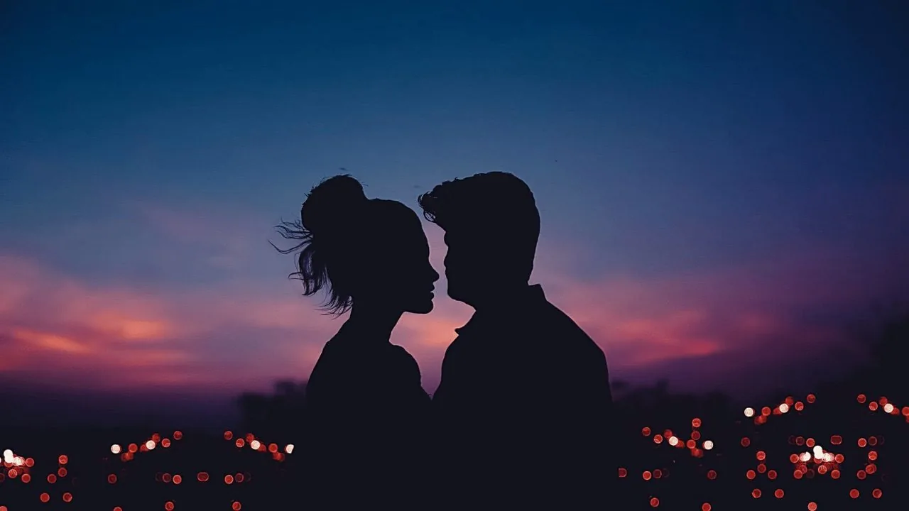 Silhouette of lovers standing face to face
